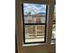View through windows showing rooftop, balcony, and mountain scenery at 3025 Broadway St # 17, Boulder, CO 80304
