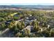 Beautiful aerial view of a home nestled in a forest, showcasing the surrounding landscape at 108 Castle Pines N Dr, Castle Rock, CO 80108