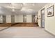 Finished basement with wood floor section perfect for home gym, offering versatile space at 108 Castle Pines N Dr, Castle Rock, CO 80108