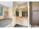 Bathroom with large vanity, mirror, and access to shower, provides ample space and convenience at 108 Castle Pines N Dr, Castle Rock, CO 80108