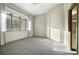 Bright bedroom features large windows and neutral carpeting, creating a serene and inviting atmosphere at 108 Castle Pines N Dr, Castle Rock, CO 80108
