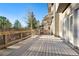 Spacious deck with wood flooring and railing perfect for enjoying the outdoors at 108 Castle Pines N Dr, Castle Rock, CO 80108