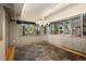 Charming dining area with large windows, a decorative chandelier, and built-in shelving at 108 Castle Pines N Dr, Castle Rock, CO 80108