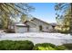 Inviting home with a three-car garage and well-maintained landscaping at 108 Castle Pines N Dr, Castle Rock, CO 80108
