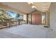 Inviting front entrance featuring a covered porch, stone accents, and double front doors at 108 Castle Pines N Dr, Castle Rock, CO 80108