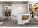 An elegant hallway featuring stone accents and stairs leading to the kitchen at 108 Castle Pines N Dr, Castle Rock, CO 80108