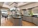 Open kitchen features a large island with a cooktop and sink at 108 Castle Pines N Dr, Castle Rock, CO 80108