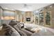 Cozy living room featuring a fireplace, comfortable seating, and expansive windows offering stunning views at 108 Castle Pines N Dr, Castle Rock, CO 80108