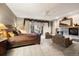 Expansive main bedroom suite featuring a fireplace, sitting area, and access to a private balcony, perfect for relaxation at 108 Castle Pines N Dr, Castle Rock, CO 80108