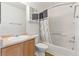 Clean bathroom with a tub and shower combination, vanity with sink, and a mirrored medicine cabinet at 5798 Biscay St, Denver, CO 80249