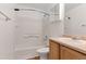 Clean bathroom with a shower-tub combination and a vanity at 5798 Biscay St, Denver, CO 80249