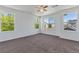 Spacious bedroom featuring lots of natural light from several windows and neutral carpet at 5798 Biscay St, Denver, CO 80249