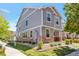 Charming two-story home with gray siding, brick accents, and a well-maintained front lawn at 5798 Biscay St, Denver, CO 80249