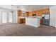 Well-lit kitchen with stainless steel appliances, tile flooring, and access to the backyard at 5798 Biscay St, Denver, CO 80249