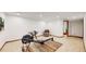 Partially finished basement area with an exercise machine, neutral walls and flooring at 2364 Autumn Ridge Blvd, Lafayette, CO 80026