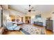 Spacious bedroom suite with hardwood floors, fan, natural light and attached sitting room at 2364 Autumn Ridge Blvd, Lafayette, CO 80026