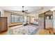 Airy bedroom suite with hardwood floors, ceiling fan, natural light and sitting area at 2364 Autumn Ridge Blvd, Lafayette, CO 80026