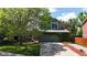 Charming home featuring lush greenery, a well-manicured lawn, and mature trees in a serene setting at 2364 Autumn Ridge Blvd, Lafayette, CO 80026