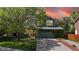 Beautiful home front view with lawn, garden, attached garage, and stunning sunset background at 2364 Autumn Ridge Blvd, Lafayette, CO 80026