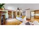 Living room featuring hardwood floors, built-in bookshelves, a fireplace, and comfortable furniture at 2364 Autumn Ridge Blvd, Lafayette, CO 80026