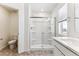 Bathroom featuring a walk-in shower with glass doors and vanity at 27460 E Cedar Pl, Aurora, CO 80018