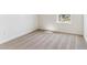Bright bedroom features a window with natural light, and plush carpet at 27460 E Cedar Pl, Aurora, CO 80018