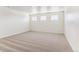 Spacious bedroom with large windows providing natural light and neutral carpeting at 27460 E Cedar Pl, Aurora, CO 80018