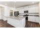 Modern kitchen with stainless steel appliances, granite countertops, and ample white cabinetry at 27460 E Cedar Pl, Aurora, CO 80018