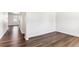Bright living room with sleek hardwood floors and white trim, showcasing a modern aesthetic at 27460 E Cedar Pl, Aurora, CO 80018