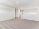 Open loft area featuring plush carpeting, recessed lighting, and plenty of natural light at 27460 E Cedar Pl, Aurora, CO 80018