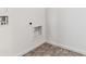 This utility room features tile flooring and a modern look with hookups for appliances at 27460 E Cedar Pl, Aurora, CO 80018