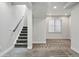 Finished basement with stairs leading up, and plush carpet at 5419 Uinta St, Denver, CO 80238