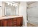 Bathroom featuring a double sink vanity, and shower with tub at 5419 Uinta St, Denver, CO 80238