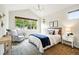 Bright main bedroom with vaulted ceilings, large windows, and elegant furnishings at 5419 Uinta St, Denver, CO 80238
