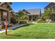 Charming home exterior with a well-maintained lawn and landscaped front yard at 5419 Uinta St, Denver, CO 80238