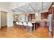 Gourmet kitchen featuring a large island with seating, modern appliances, and beautiful cabinetry at 5419 Uinta St, Denver, CO 80238