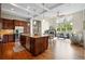 Spacious kitchen with a large island, stainless steel appliances, and a view to the living room at 5419 Uinta St, Denver, CO 80238