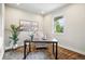Bright office with a large window, modern desk, neutral walls, and plush carpet at 5419 Uinta St, Denver, CO 80238