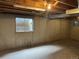 Unfinished basement with concrete walls, exposed ceiling, and small window at 10008 Quivas St, Thornton, CO 80260