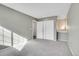 Light-filled bedroom with sliding closet doors and soft carpet at 10008 Quivas St, Thornton, CO 80260