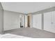 Spacious carpeted bedroom with neutral walls, and closet with double sliding doors at 10008 Quivas St, Thornton, CO 80260