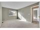 Light-filled bedroom with soft carpet and sunlit window at 10008 Quivas St, Thornton, CO 80260