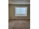 Bedroom with carpet and large window with blinds, providing natural light at 10008 Quivas St, Thornton, CO 80260