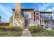 Charming townhouse featuring stone accents, landscaped front yard, and curb appeal at 10008 Quivas St, Thornton, CO 80260