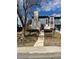 Charming two-story home with stone chimney and inviting entrance, set on a well-kept lawn at 10008 Quivas St, Thornton, CO 80260