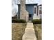 Charming entrance with a stone chimney and a wrought iron front door at 10008 Quivas St, Thornton, CO 80260