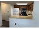 Well-lit kitchen with stainless steel appliances, and ample counter space at 10008 Quivas St, Thornton, CO 80260