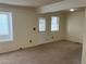 Living room featuring a bright front door and carpeted floors at 10008 Quivas St, Thornton, CO 80260