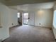 Spacious living room featuring neutral carpet, ample natural light, and a welcoming atmosphere at 10008 Quivas St, Thornton, CO 80260