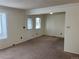 Inviting living room with a front door and carpeted floors at 10008 Quivas St, Thornton, CO 80260